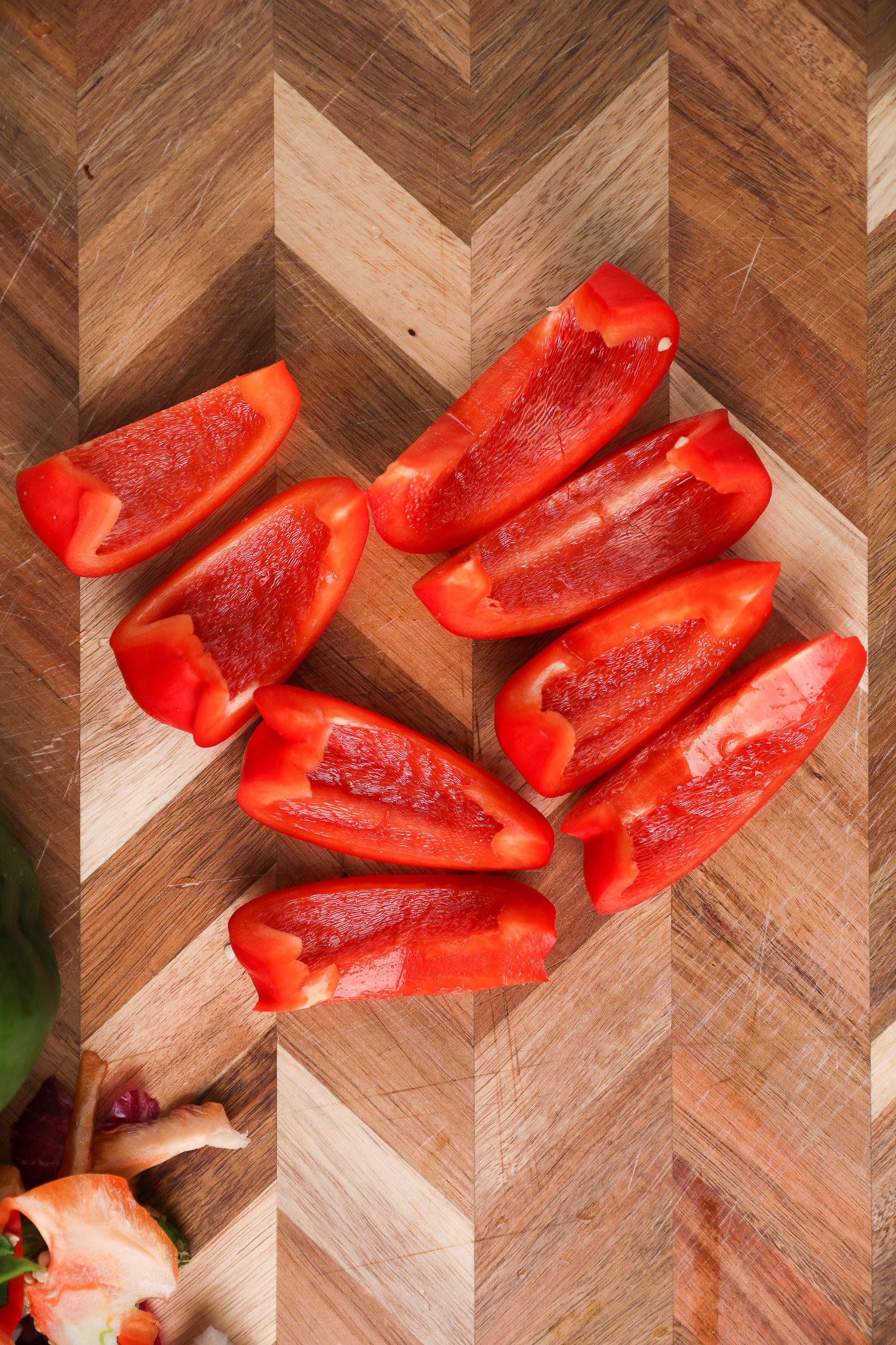 A red bell pepper, deseeded and sliced into 8 pieces.