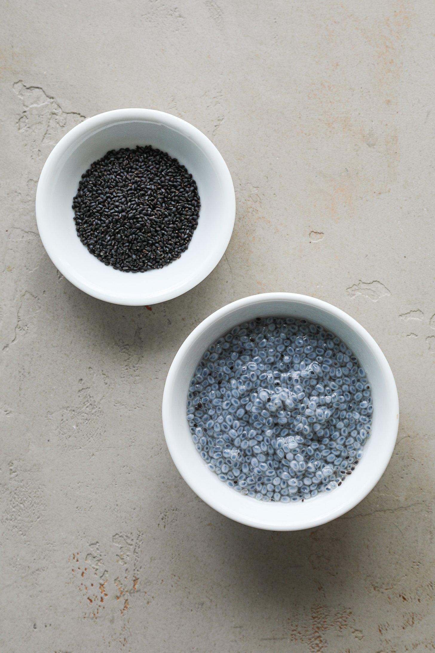 An image of 2 ramekins; one with dry basil seeds and the other with soaked basil seeds.
