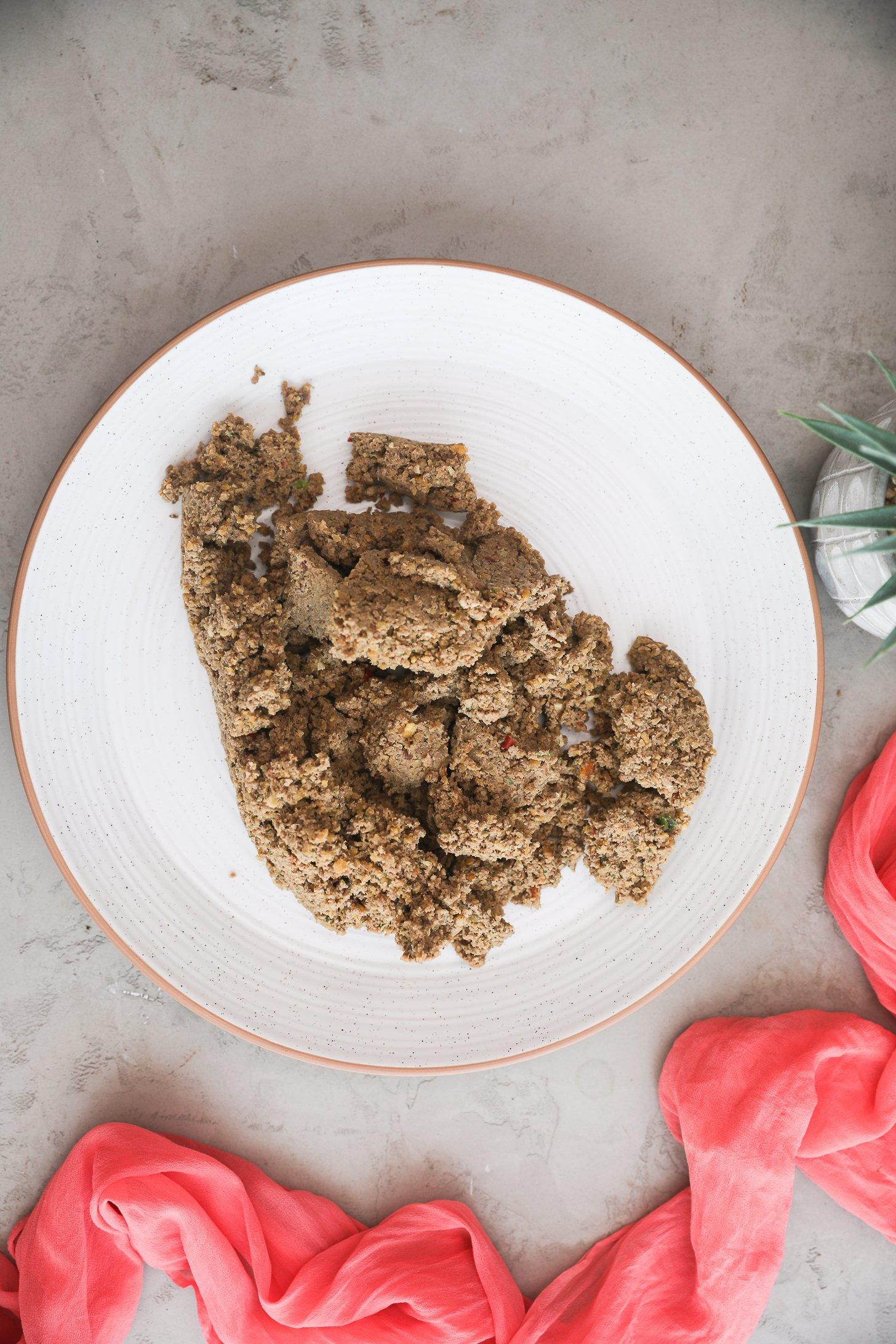 Blended shami kebab mixture on a white plate.