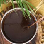 Glossy tamarind chutney in a saucepan after cooking.